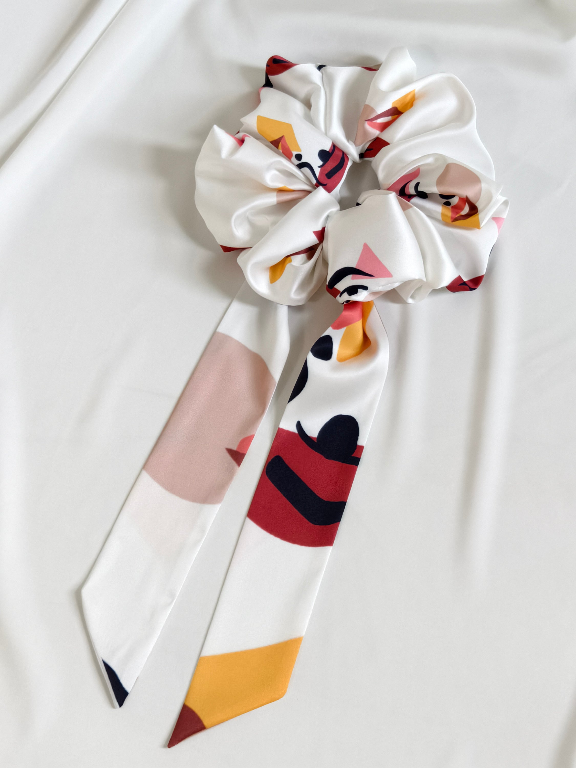 Colorful bow with abstract design on a white background