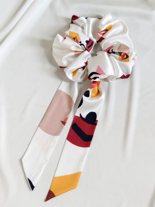 Colorful bow with abstract design on a white background